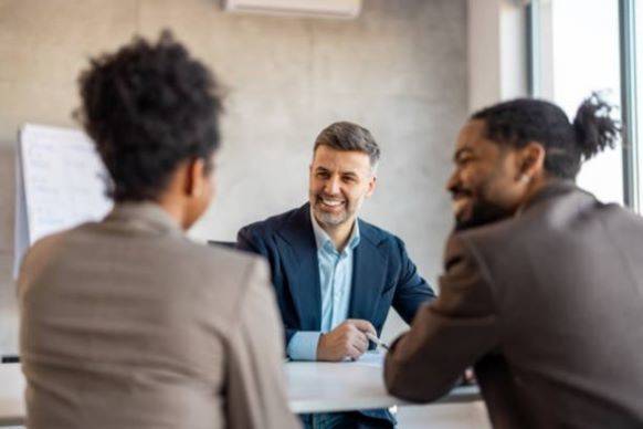 Couple meeting with Wealth Advisor in office